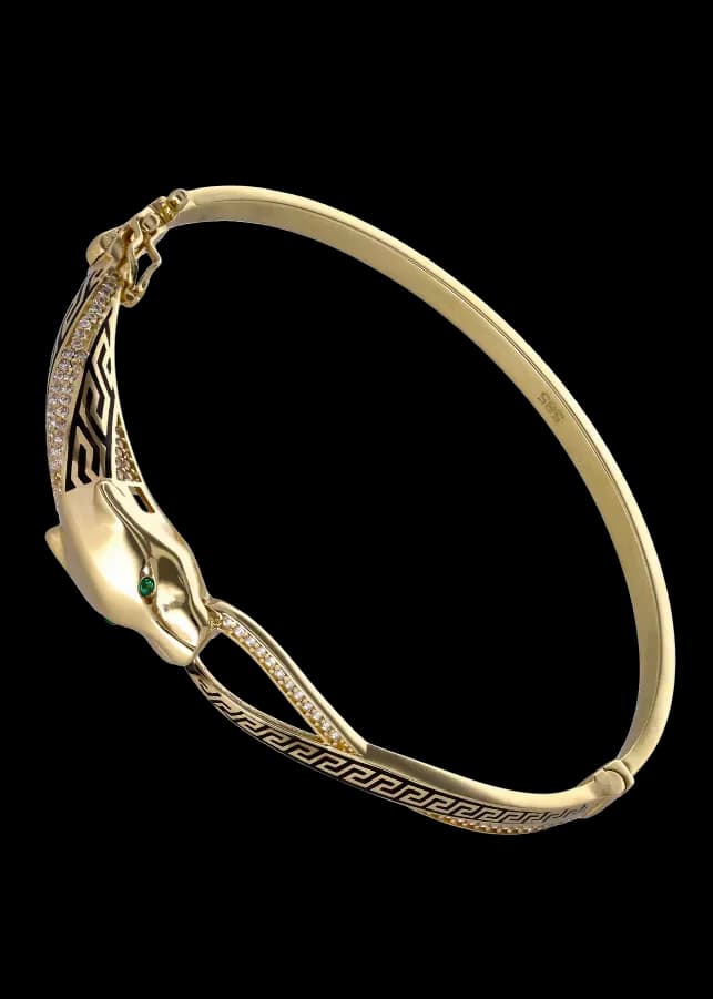 Armbånd med gullfarget panterhode, grønne øyne, diamanter og emalje